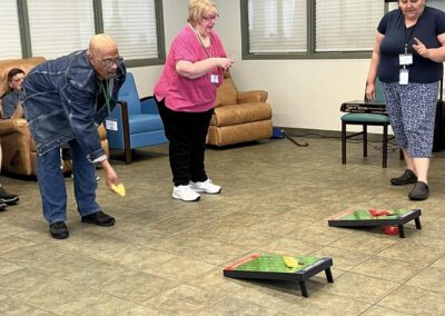 Participants play cornhole