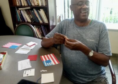 A man designs an American flag with star stickers